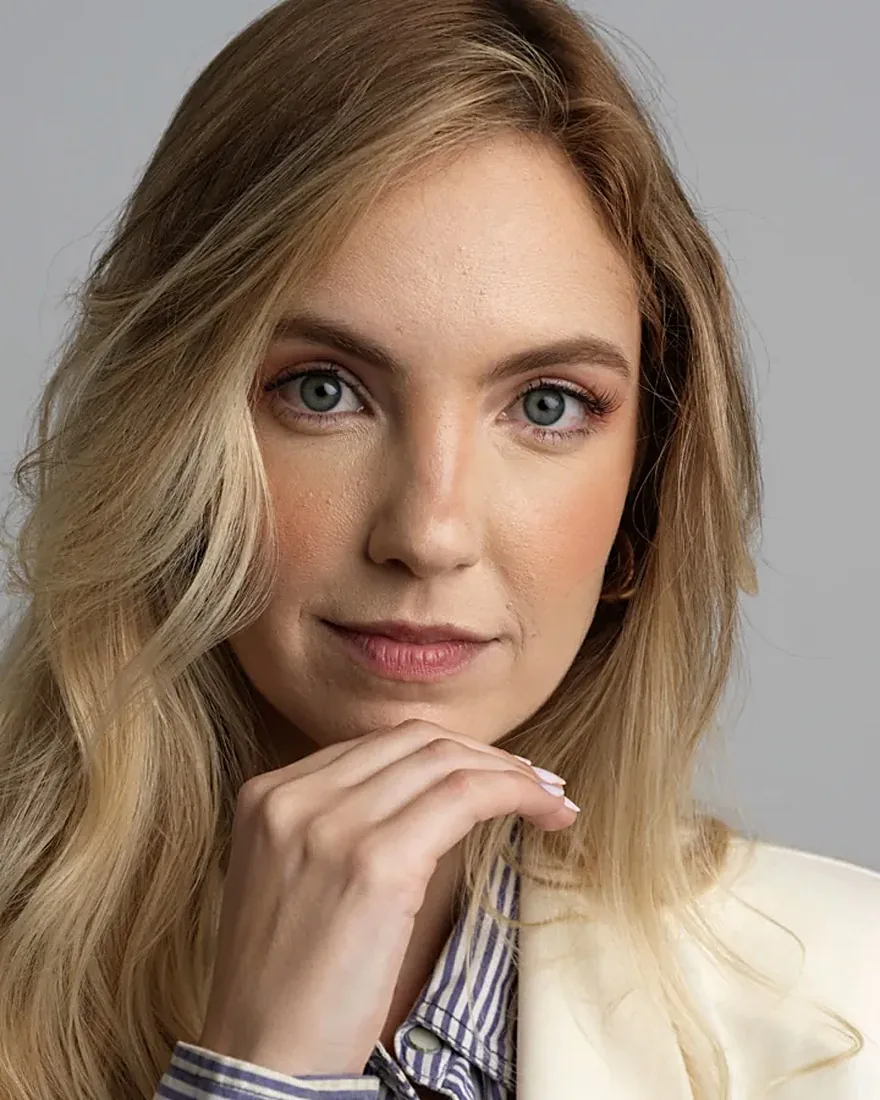The headshot Jobtelligence returned: sharp focus, neutral studio background, even lighting, visible professional wardrobe.